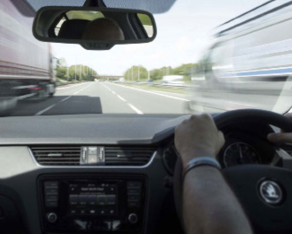 view through car windscreen driving on motorway